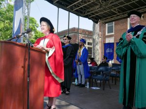 Nancy Johnson, Associate Dean, left, Barbara G Lyman, Interim Provost and Vice President of Academic Affairs, second from left, Student Address speaker Mackenzy McMorris, third from left, and University President Donald P. Christian, right.