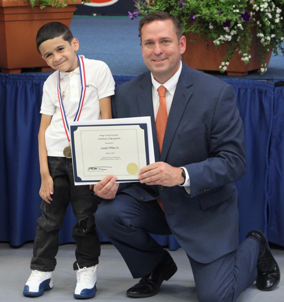 Orange County Executive Steven M. Neuhaus and Isaiah White Jr., a student at Presidential Park Elementary School in Middletown, at the Youth Bureau's County Executive Awards on Thursday, June 9 at SUNY Orange. White was recognized with the Youth Bureau's Spirit of Success award.
