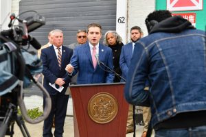 Senator James Skoufis stands with Assemblymember John McDonald and City of Albany officials during a code enforcement legislation announcement.