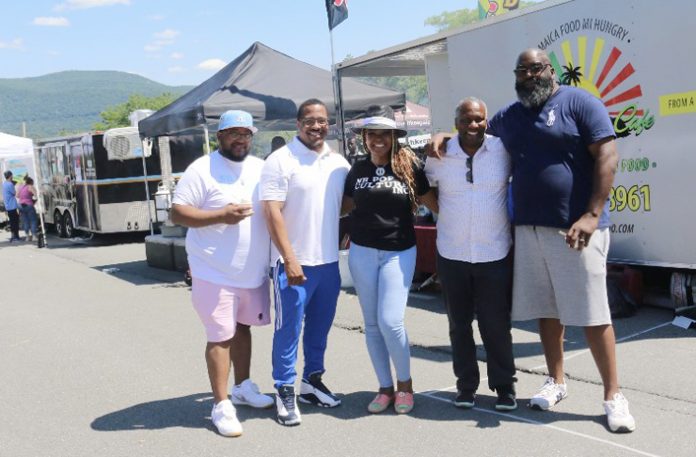 Ronnie Fisher, Mayor Torrance Harvey, Sonya Grant, Councilman Anthony Grice, and Marcus Simmons pose for a photo at the Food Truck Festival held on July 3, 2022.