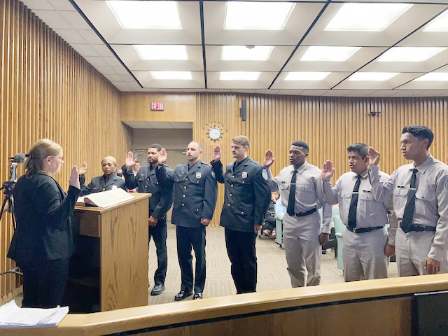 City of Poughkeepsie Deputy City Chamberlain, Donna Deluca, leads the Oath new police officers in the City of Poughkeepsie took Friday afternoon.