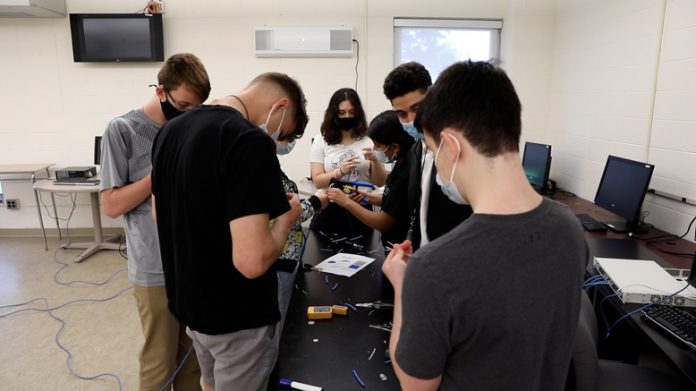 SUNY Westchester Community College (SUNY WCC) hosted approximately fifty high school students for a free summer Cybersecurity Camp that exposed them to this fast-growing sector in information technology. Pictured above, Wire Testing taking place during the camp.