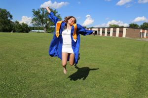 Saugerties senior Lacey Schatzel jumps for joy moments before her graduation on Friday, June 24.