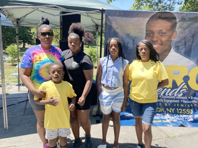Jemika Hall posed with her family at the Fun Run which was held in honor of her son Marc who was murdered.
