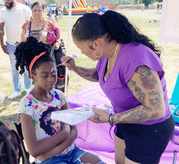 On Sunday, August 14th community members came to the Newburgh Armory Unity Center to remember teenagers Omani Free and Tabitha “Tabby” Cruz. Both were murdered at a Halloween Party on Broadway on October 30, 2016. Pictured above are children who took pleasure in getting their faces painted for free at Omani & Tabby Day.