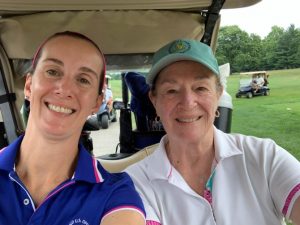 Gretchen Price Muller, Golf Participant and Darlene Price, Golf Participant and Board of Directors member pose for a photo.