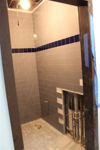 Tiling has already been installed in one of the bathrooms located in the main office.