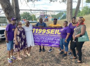 Members of the 1199 SEIU United Healthcare Workers East pass out information at the Poughkeepsie Riverfest aimed to stop gun violence.