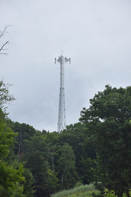 A County-erected tower atop a Rock Hill peak is now in operation, with a public cell signal available to areas long unserved or underserved.