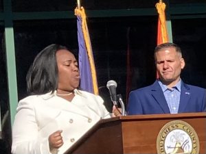 Desiree S. King provides an emotionally- charged rendition of “God Bless America” as Dutchess County Executive, Marcus Molinaro looks on during Friday’s 9/11 Memorial Service held in the City of Poughkeepsie.