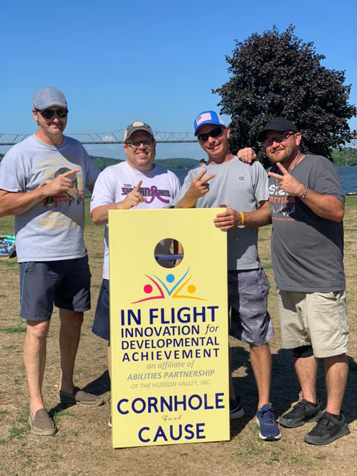 In Flight, Inc.’s Cornhole for a Cause Professional Tournament Winners - (from left to right) Dymond and Dave - First place and Tim and Drew - Second Place.