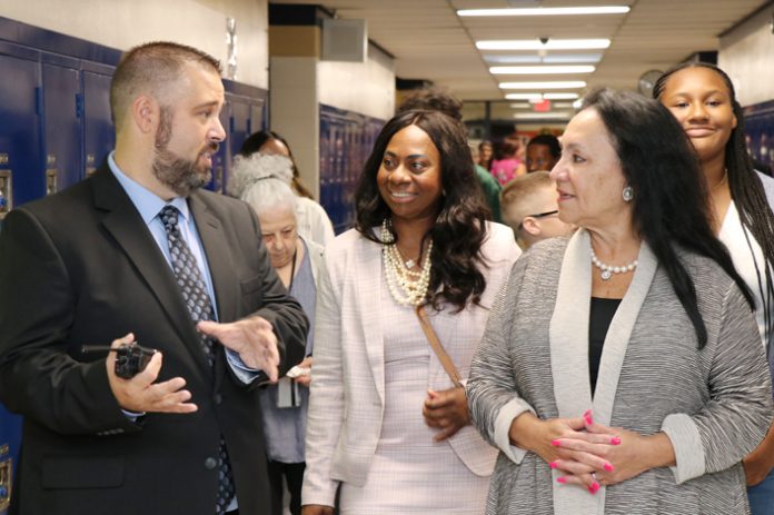 Newburgh’s new superintendent, Dr. Jackielyn Manning Campbell (center), and NYS Commissioner of Education, Dr. Betty Rosa (right), speak with a NECSD administrator.