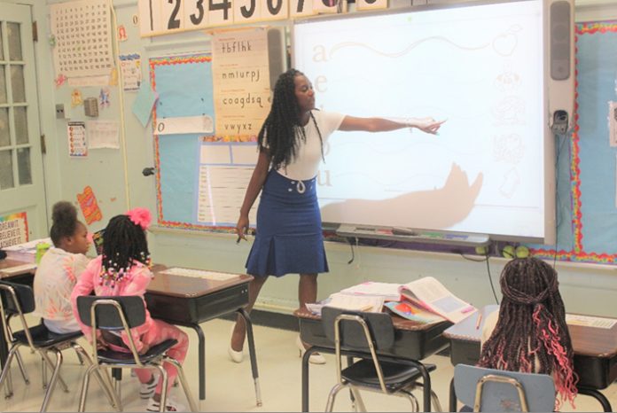 Jasmine Davidson, a first grade teacher at Clinton Elementary School, is happy to be back not only in the school she attended as a student, but the very same classroom she learned her core subjects in.