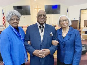 Reverend Dr. Jesse Voyd Bottoms, Jr. poses with his sisters following his 45th Pastoral Anniversary Celebration.