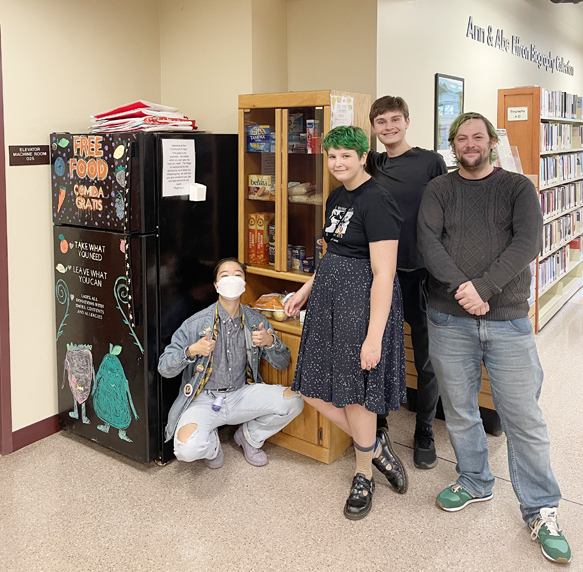Oakwood students Kishi Oyagi, Theo Hirmes, Trevor Brooks and PPLD’s Head of Community Engagement TJ Lamanna on fridge installation day. What started as a project to address food insecurity in Oakwood’s Literature of Direct Action class has grown into a community collaboration with Poughkeepsie Public Library District (PPLD) and the installation of Poughkeepsie’s first Community Fridge at Adriance Memorial Library.