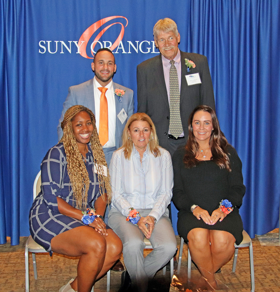 The SUNY Orange Colt Athletic Hall of Fame inducted the Class of 2022 on Nov. 12. Five individuals along with the 1999 softball team were inducted, including: (front row from left), Natalie Griffin ’98 (volleyball), Stacey Morris ’89 (head coach representing the 1999 softball team) and Shannon Donohue ’06 (softball), as well as (second row, from left), Mike Casabona ’10 (baseball) and Terry Foster ’67 (basketball). In addition, James Hannigan ‘’53 (wrestling) was inducted posthumously. 
