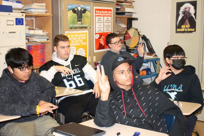 Grade 9 students practice signing the number “26” during lessons covering the numbers 20-29 in Melissa Mourges’s new American Sign Language class at Wallkill Senior High School. Pictured in the front are Collin Seavers-Lockett and William Ngo, and in the back are Alex Hernandez, Daniel Beck, and C.J. Nelson.