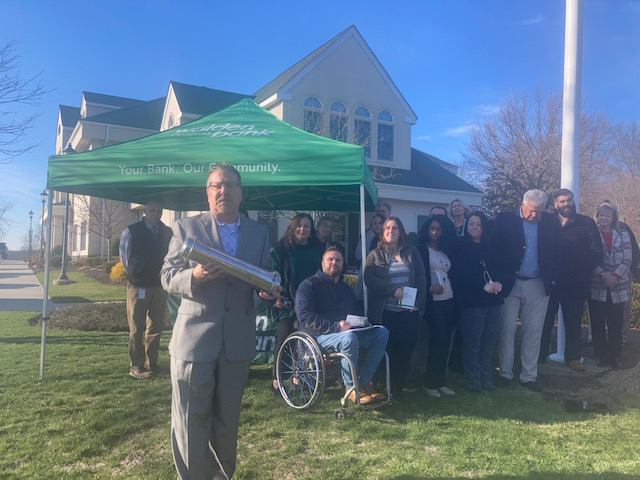 Derrik Wynkoop, Bank President and CEO of Walden Savings Bank, shows off the impressive time capsule that was buried outside of the Scott’s Corners, Montgomery branch last Tuesday afternoon.