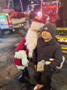 Guests at the City of Newburgh’s Annual Holiday Tree Lighting have fun with Santa Clause.