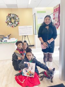 On left, Middletown’s Danielle Wade with her children Jadison and Jenova. On right, New Windsor’s Viktorya Ochoa and French Bulldog, Cali Blue Lorenzo. All were on hand at Saturday’s Healthfirst Holiday Fun with Santa event.