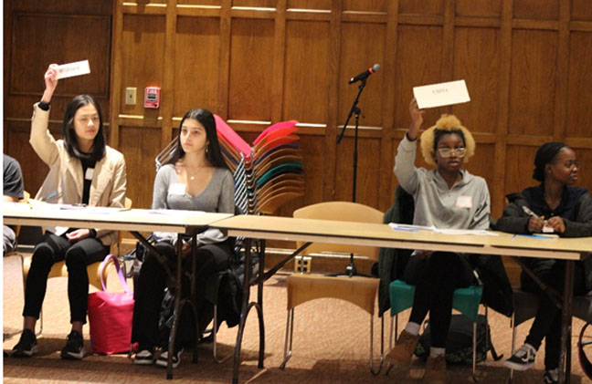 Eleven students from Poughkeepsie High School came together to debate points and work together with Wappingers Central School District students to come up with resolutions during Dutchess BOCES’ High School Model United Nations at Vassar College on December 15.
