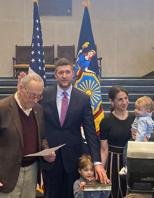 Newly elected New York State Senator, Patrick Ryan, surrounded by his wife, Rebecca, and children is sworn into office by Senate Majority Leader, Chuck Schumer, at Sunday’s ceremony, held at the United States Military Academy.
