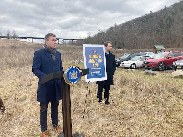 Senator James Skoufis (D-Hudson Valley) stresses the dire need to enforce fines on the Developer for the Clovewood Project in South Blooming Grove due to their refusal to heed the now six Stop Work Orders imposed by the Department of Environmental Protection due to their inability to secure required work permits for the 600 home development and poses harmful environmental and quality-of-life impacts.