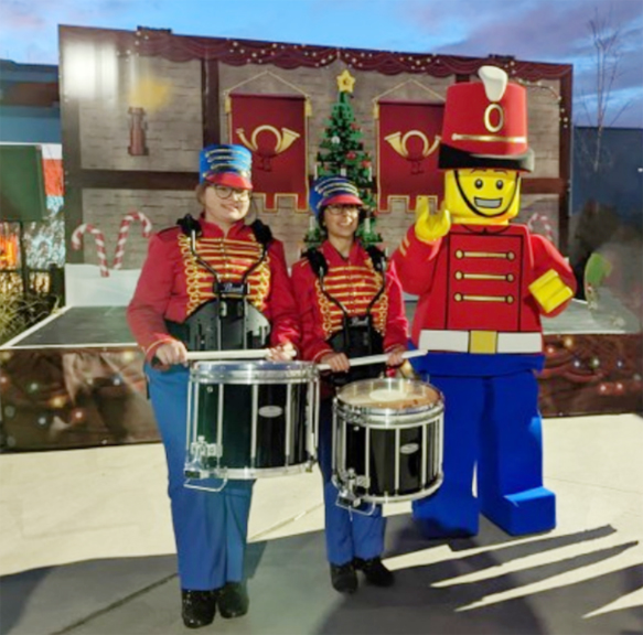 NFA high school students Samantha Yozzo and Gabriella Mozo performed at Legoland as the drumline drummers for the Lego Character “Drumz.”