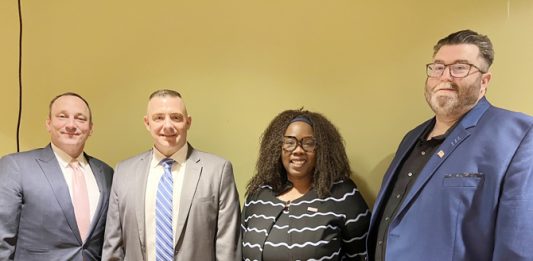 From left to right: James Rogers, Anthony Parisi, Kenya Gadsden, and Tommy Zurhellen pose for a photo.