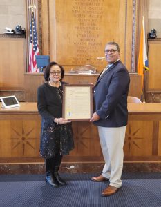 Legislator Terry Clements presents a Proclamation to Deputy Police Commissioner Neil Reynolds of New Rochelle as the Westchester County Board of Legislators celebrated Black History Month with their annual observance.