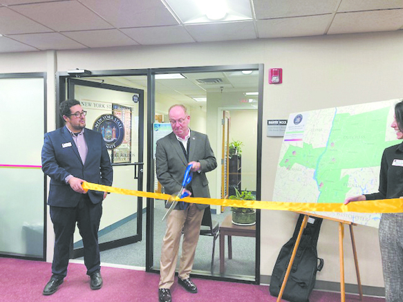 39th District Senator, and former City of Poughkeepsie Mayor, Rob Rolison, cuts the ribbon at his new 3 Neptune, Town of Poughkeepsie office Thursday afternoon.