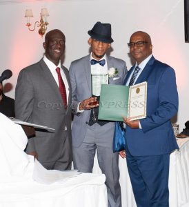 Glendon Fraser, left, and Ronald Brereton, right, presents Sadiki Pierre, center, with the Trowell-Harris Menotoring Award at the 25th Annual Tuition Assistance Awards Celebration of the Major General Irene Trowell-Harris Chapter of the Tuskegee Airmen which was held on Saturday, February 4, 2023 at Colden Manor at Spruce Lodge in Montgomery, NY. Hudson Valley Press/CHUCK STEWART, JR.