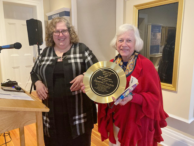 On left, Elyse B. Goldberg, Historic Site Manager at Washington’s Headquarters State Historic Site, presents the 2023 General’s Lady Plaque to recipient, Colette C. Fulton, Sunday afternoon.