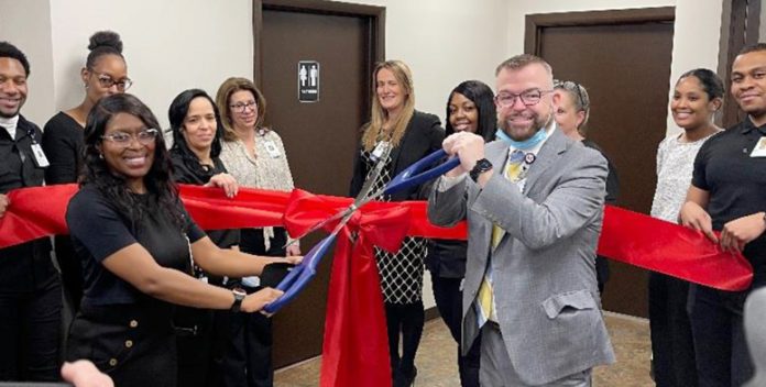 Dr. Uticia Belfield, MD, and MSLC President & CEO Daniel Maughan cut the ribbon at the Grand Opening for the Medical Group at MSLC.