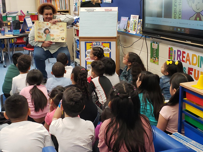 Adhara Jimenez-Banse reads “Tomatoes for Neela” to a class at Gardnertown Leadership Academy during “New York Agriculture in the Classroom” 2023.