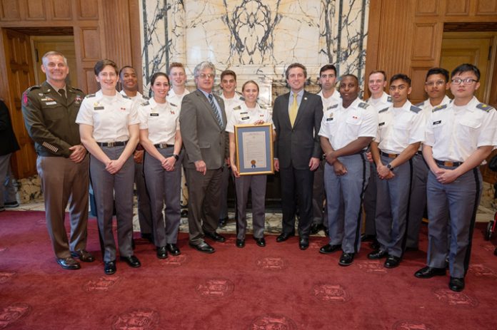 Assemblyman Eachus and Senator Skoufis present the resolution to cadets during a luncheon in the State Capitol.