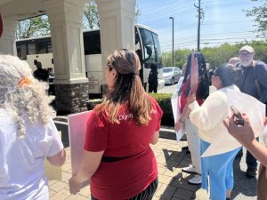 Last Thursday, members of grassroots organization For the Many and local elected officials greeted two buses of asylum seekers at Newburgh’s Crossroads Hotel. Photo: Rene Mejia
