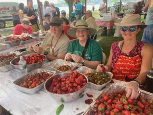 Members of the Beacon Sloop Club were hard at work Sunday preparing over 1500 strawberry shortcakes for the large crowd at the Pete and Toshi Seeger Riverfront Park.