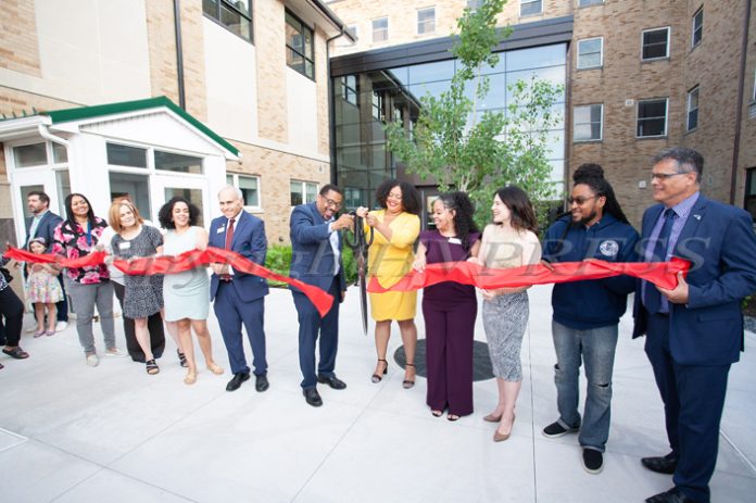 Newburgh Mayor Torrance Harvey and Genesis Ramos, executive director of the Desmond Center for Community Engagement and Wellness, cut the ribbon during the grand opening of the recently renovated Guzman Hall – home of the Desmond Center for Community Engagement and Wellness on Thursday, June 15, 2023. Hudson Valley Press/CHUCK STEWART, JR.