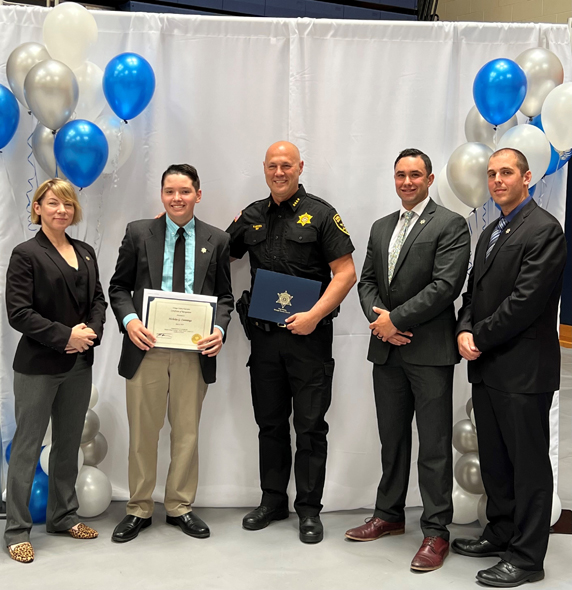 (From left to right) Chief Meredith McGovern of the Orange County Sheriff’s Office, Goshen sophomore Nicholas Cummings, Orange County Sheriff Paul Arteta, Deputies Luke Solomon and Joseph April. Cummings was awarded with a Youth Award: Positive Change Leading To Success. Winners have overcome a difficulty, are succeeding in school and have become role models to other youth.