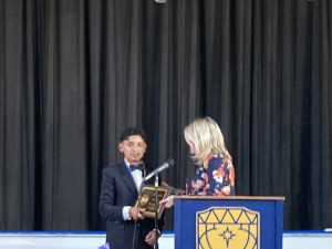 Gustavo Laureano, the Valedictorian for San Miguel Academy’s Class of 2023 receives a “Grit and Grace” Award Thursday night at the Commencement Exercises. 
