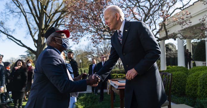 President Joe Biden greets guests after the signing of H.R. 55, the “Emmett Till Antilynching Act”, Tuesday, March 29, 2022, in the White House Rose Garden. Photo: Erin Scott