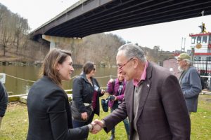 U.S. Senate Majority Leader Charles E. Schumer (right) shakes hands with NYS Senator Michelle Hinchey (left) after Shumer announced he has secured a game changing $21.7 million to help revitalize Kingston Waterfront.