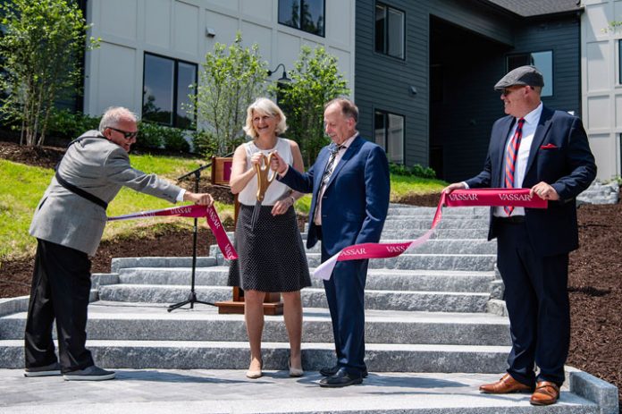 President Bradley and Town of Poughkeepsie Supervisor Jay Baisley cut the ribbon, officially opening Vassar’s state-of-the-art faculty and staff housing facility. Far left: David Kaminsky of TC Development Corp; Far right: Anthoiny Ripley, project manager.