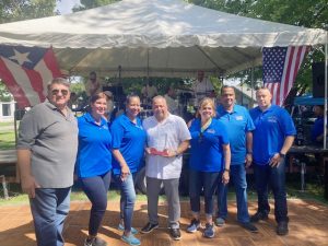 George Serrano, Walkkill Town Supervisor, pictured in white shirt, was one of two local politicians honored at Saturday’s 9th Annual Fiesta Latina, held at Monroe’s Museum Village. 