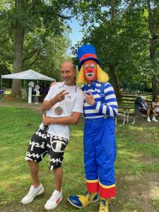On left, City of Newburgh Council member, Omari Shakur, shares a fun moment with one of the various entertainers at Saturday’s Annual Birthday Celebration for Omani &Tabby Day.