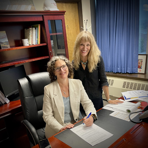 Ulster County Exec Jen Metzger signs Green Fleet Law with Chairwoman Bartels.