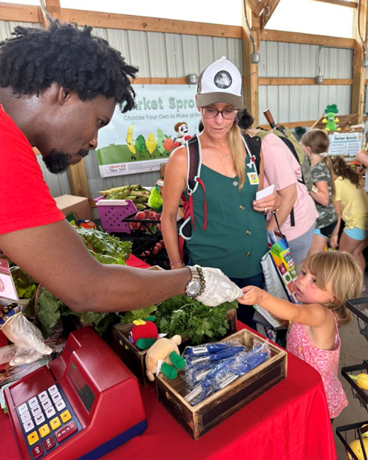 Kids enjoyed earning their own “Market Sprouts Bucks” and using them to choose their own produce to take home during the Country Fair.