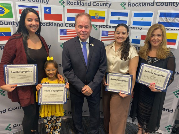 Pictured with County Executive Ed Day are those honored this year: Elizabeth Rubio, Julia Urena, Jelien Ramos, and Kenia Serrano.