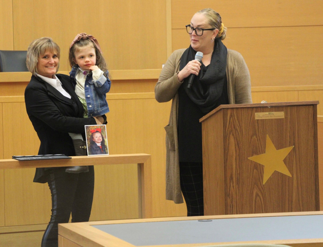 Orange County Court Judge Christine Krahulik holds Aniyah Dittbrenner of Pine Bush at Friday’s Adoption Day ceremony. Looking on is Aniyah’s mom, Shannon Dittbrenner. Ms. Dittbrenner adopted Aniyah, 5, in 2021.